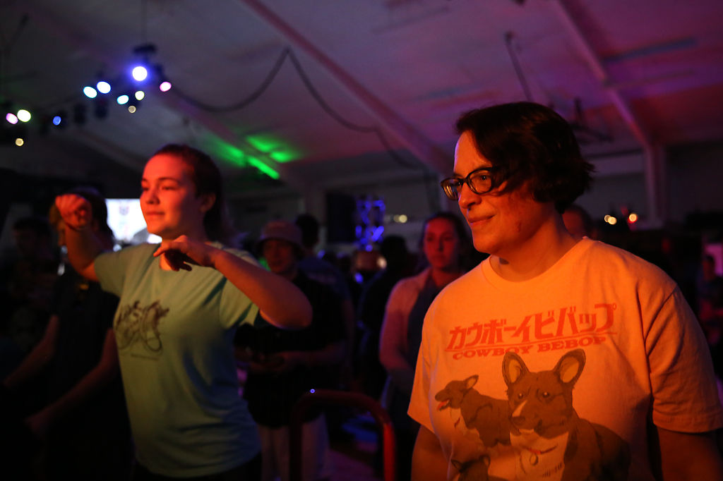 Elizabeth Bent, right, and her daughter Sofia Bent play a dancing game